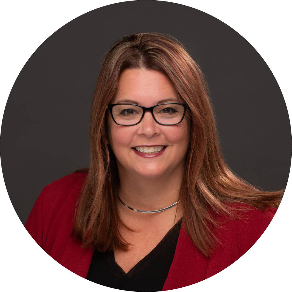 Deb Thompson smiling for her GVSU headshot.